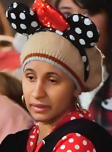 Cardi B is wearing mickey mouse ears in Disneyland