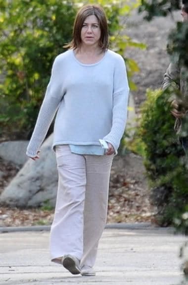 Jennifer Aniston wearing ordinary sweater and pants