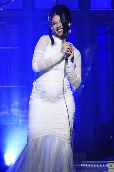 Cardi B wearing a white angelic long dress