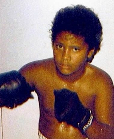 Dwayne Johnson posing as a young boxer