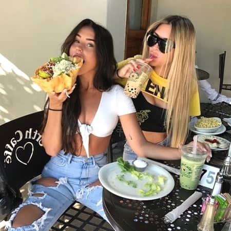 Madison Beer having a big taco