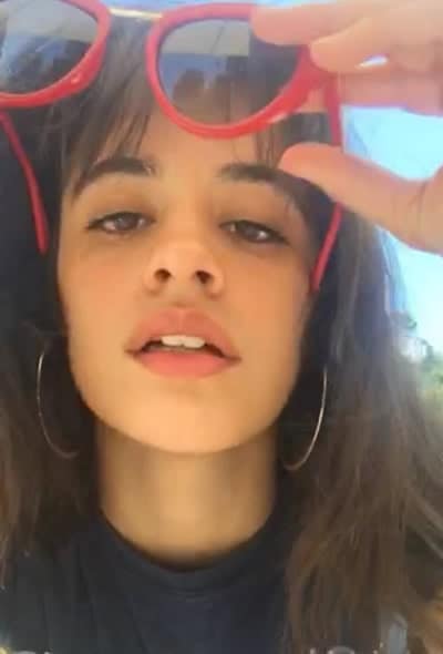 Camila Cabello taking off her sunnies