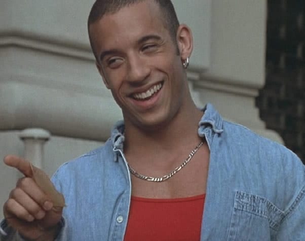 Vin Diesel trademark smile and single earring