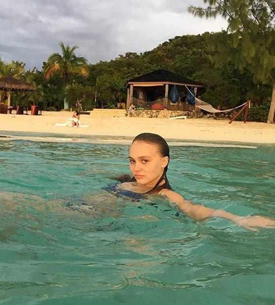 Lily-Rose Depp swimming at a beautiful beach